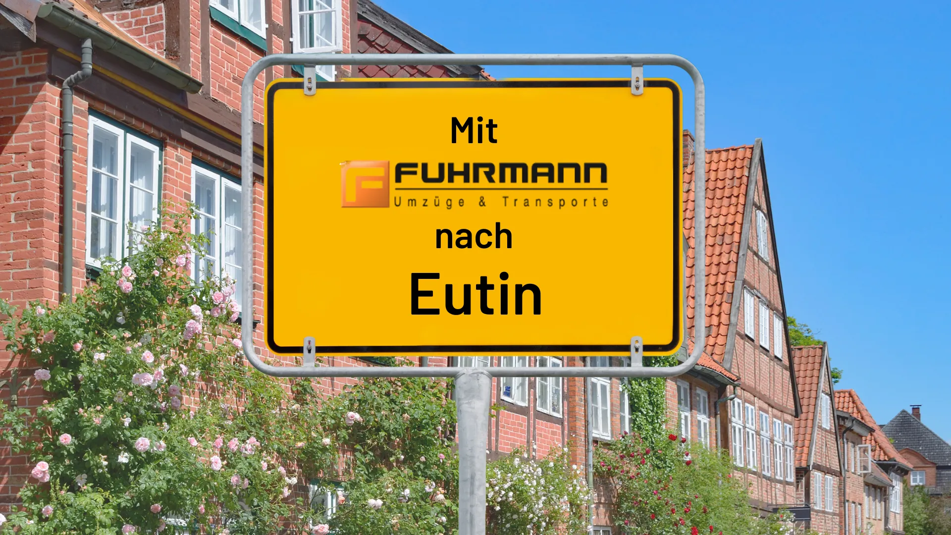 Mit Fuhrmann Umzüge nach Eutin — gelbes Ortsschild mit Fuhrmann-Branding